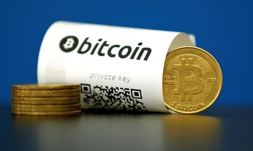 an-illustration-photo-shows-a-bitcoin-virtual-currency-paper-wallet-with-qr-codes-and-a-coin-are-seen-at-la-maison-du-bitcoin-in-paris